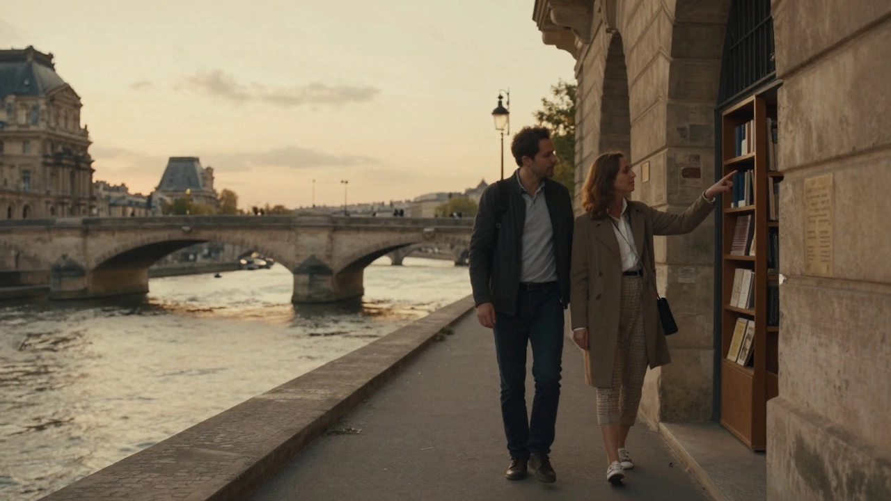 A client and escort walking along the Seine at sunset, pointing out a hidden bookstore under a stone bridge.